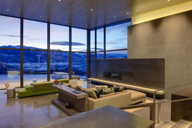 Inspiration for a large contemporary open concept concrete floor living room remodel in Denver with beige walls, a ribbon fireplace, a metal fireplace and no tv