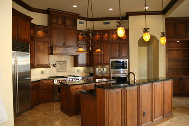 This is an example of a traditional kitchen in Jacksonville with medium wood cabinets.