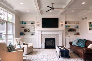Family room - mid-sized contemporary enclosed medium tone wood floor and brown floor family room idea in Tampa with gray walls, a standard fireplace, a tile fireplace and a wall-mounted tv