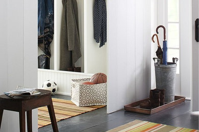 Eclectic dark wood floor entryway photo in Burlington with white walls