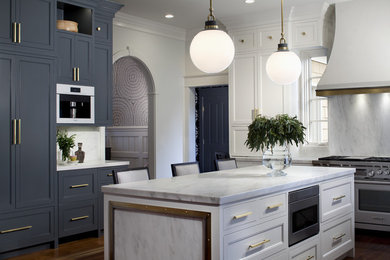 Enclosed kitchen - transitional dark wood floor and brown floor enclosed kitchen idea in Baltimore with shaker cabinets, blue cabinets, white backsplash, stone slab backsplash, stainless steel appliances, an island and white countertops