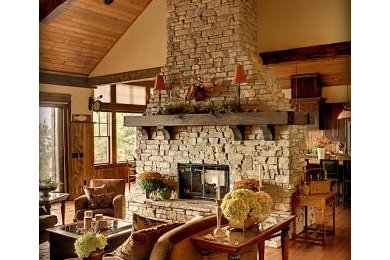 Living room - mid-sized rustic formal and open concept dark wood floor and brown floor living room idea in Minneapolis with beige walls, a standard fireplace, a stone fireplace and no tv