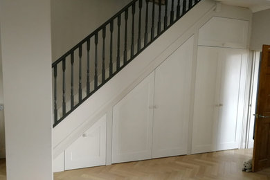 Photo of a large contemporary straight staircase in Hampshire.
