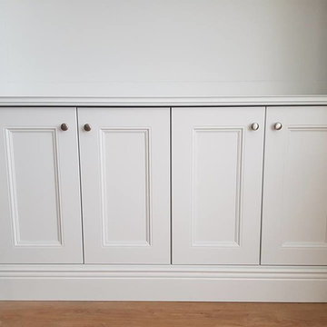 Alcove tv unit and radiator cabinet finished in pearl grey