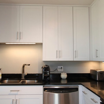 White Contemporary Kitchen with Brushed Nickel Hardware and Black Granite in DC