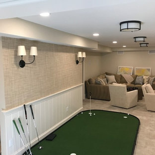 This is an example of a medium sized traditional fully buried basement in Boston with beige walls, carpet, no fireplace and grey floors.