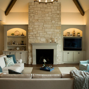 Custom built ins, stone fireplace and the proper furniture placement  and pieces