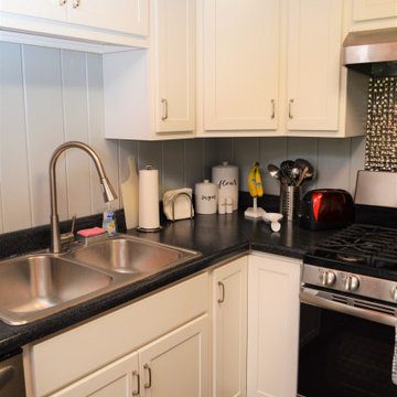 White Farmhouse Kitchen Featuring Mullion Doors. Baileytown USA