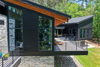 Inspiration for a mid-century modern home design remodel in Charlotte