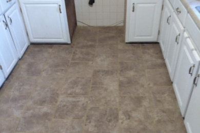 Kitchen - mid-sized traditional galley kitchen idea in Other