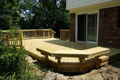 Large mountain style backyard deck photo in Cincinnati