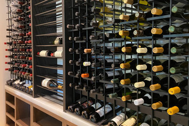 Example of a mid-sized trendy wine cellar design in Los Angeles