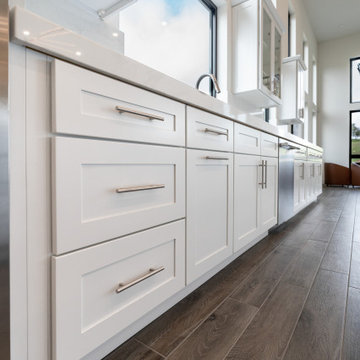Modern White Shaker Kitchen with Oversized Island & Custom Storage Solutions