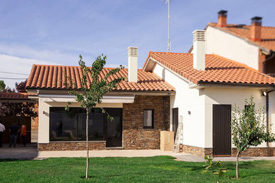 Example of a country exterior home design in Other