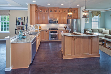 Large elegant l-shaped dark wood floor eat-in kitchen photo in Wilmington with an undermount sink, recessed-panel cabinets, light wood cabinets, granite countertops, beige backsplash, ceramic backsplash, stainless steel appliances and an island