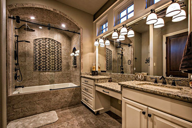 Inspiration for a large transitional master brown tile and porcelain tile porcelain tile and brown floor bathroom remodel in Other with raised-panel cabinets, beige cabinets, brown walls, an undermount sink and granite countertops