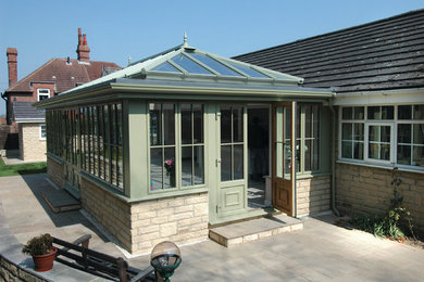This is an example of a modern sunroom in Berkshire.