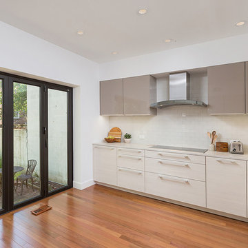 Old City, Philadelphia: Sleek Modern Kitchen with Triptych Cafe Door