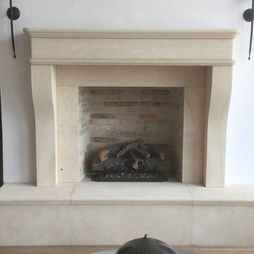Mediterranean hand-carved stone fireplace.