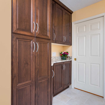 Transitional Style Laundry/Mudroom With Medium Stained Maple Cabinets