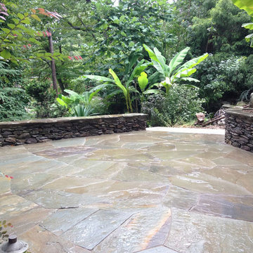 Irregular flagstone patio and dry stack PA stone retaining wall