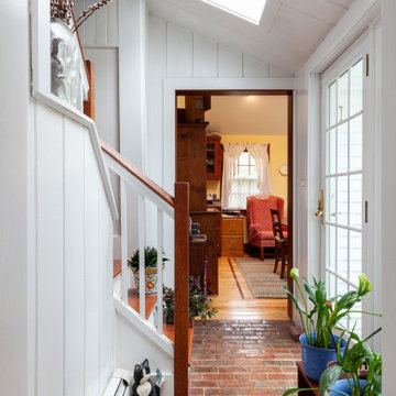 Skylit Brick Entry Hall with Staircase and Garden Door – South Hamilton MA