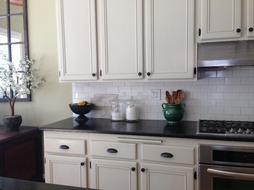 off white kitchen cabinets with white subway tile