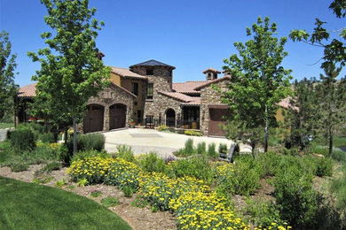 Example of a tuscan exterior home design in Denver