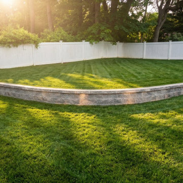 Curved Stone Retaining Wall Graded Yard Loudonville, NY