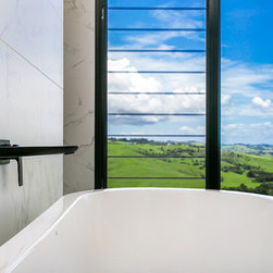 Outdoor view through breezway louvres from bath tub - Windows