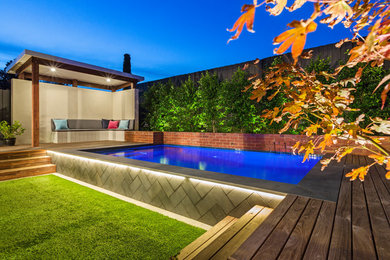 This is an example of a small modern backyard rectangular pool in Melbourne.