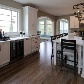 White Transitional Kitchen with Black Hardware and Glass Tile Backsplash