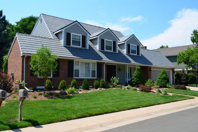 Large elegant multicolored two-story mixed siding exterior home photo in Denver with a shingle roof
