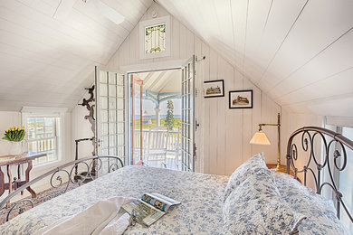 Bedroom - mid-sized coastal light wood floor bedroom idea in Boston with beige walls and no fireplace
