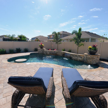 Custom Swimming Pool with Granite Tabletop and Spillway