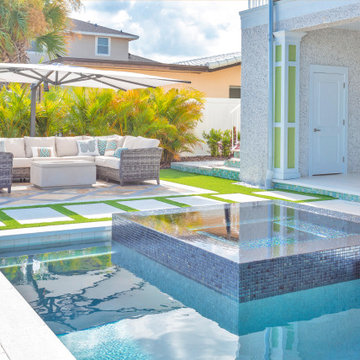 Beachfront Poolside Home Blending Tropical Charm and Contemporary Style
