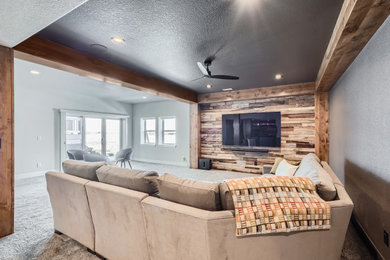 Basement - huge modern walk-out basement idea in Denver with gray walls