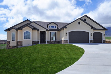 Mid-sized craftsman beige one-story stucco exterior home idea in Salt Lake City with a shingle roof