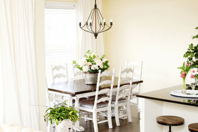 Example of a country dining room design in Calgary