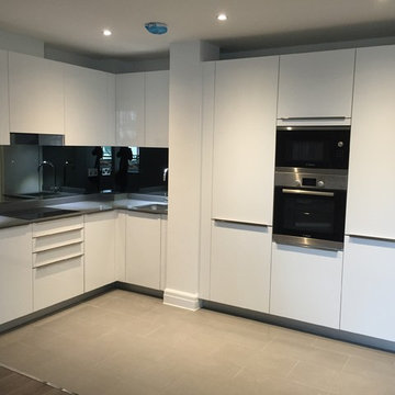 White gloss L shape open plan Kitchen