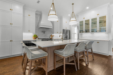 Inspiration for a large contemporary galley vinyl floor kitchen pantry remodel in Charleston with shaker cabinets, white cabinets, granite countertops, gray backsplash, ceramic backsplash, stainless steel appliances, an island and white countertops