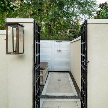 Rectangular pool, covered patio and kitchen, outdoor shower, landscaping