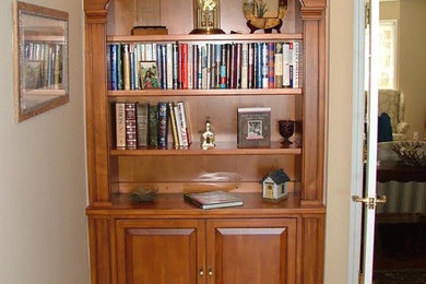 Mid-sized elegant medium tone wood floor hallway photo in Grand Rapids with beige walls