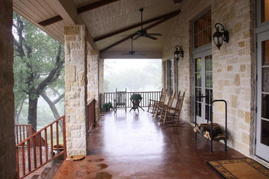 Large concrete front porch photo in Dallas