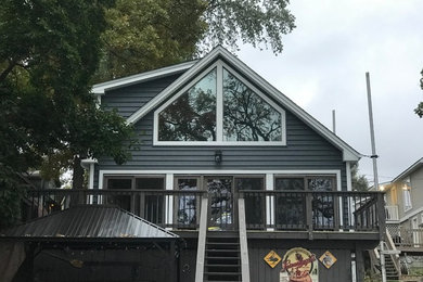 Inspiration for a timeless blue house exterior remodel in Chicago