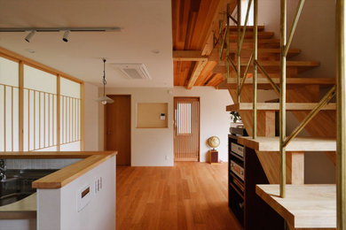 Inspiration for a country open concept living room in Tokyo Suburbs with plywood floors and wood.