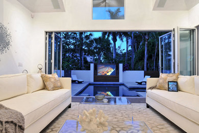 Mid-sized contemporary formal open concept living room in Tampa with white walls and porcelain floors.