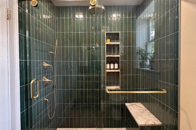 Mid-sized tuscan master green tile and ceramic tile ceramic tile, brown floor and single-sink bathroom photo in Other with flat-panel cabinets, light wood cabinets, a two-piece toilet, beige walls, an undermount sink, marble countertops and a built-in vanity