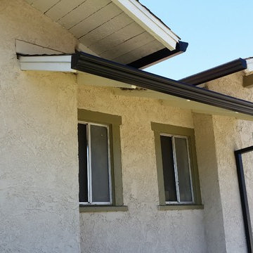 Triple Curve Rain Gutter in Black Aluminum.