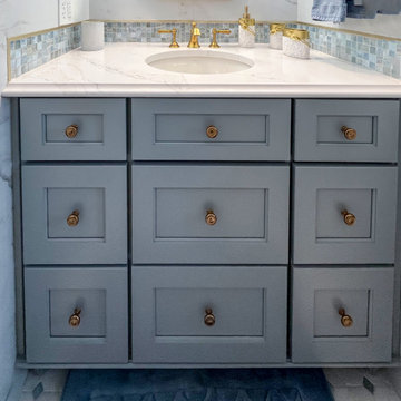 Blue and White Guest Bathroom with Gold Accents